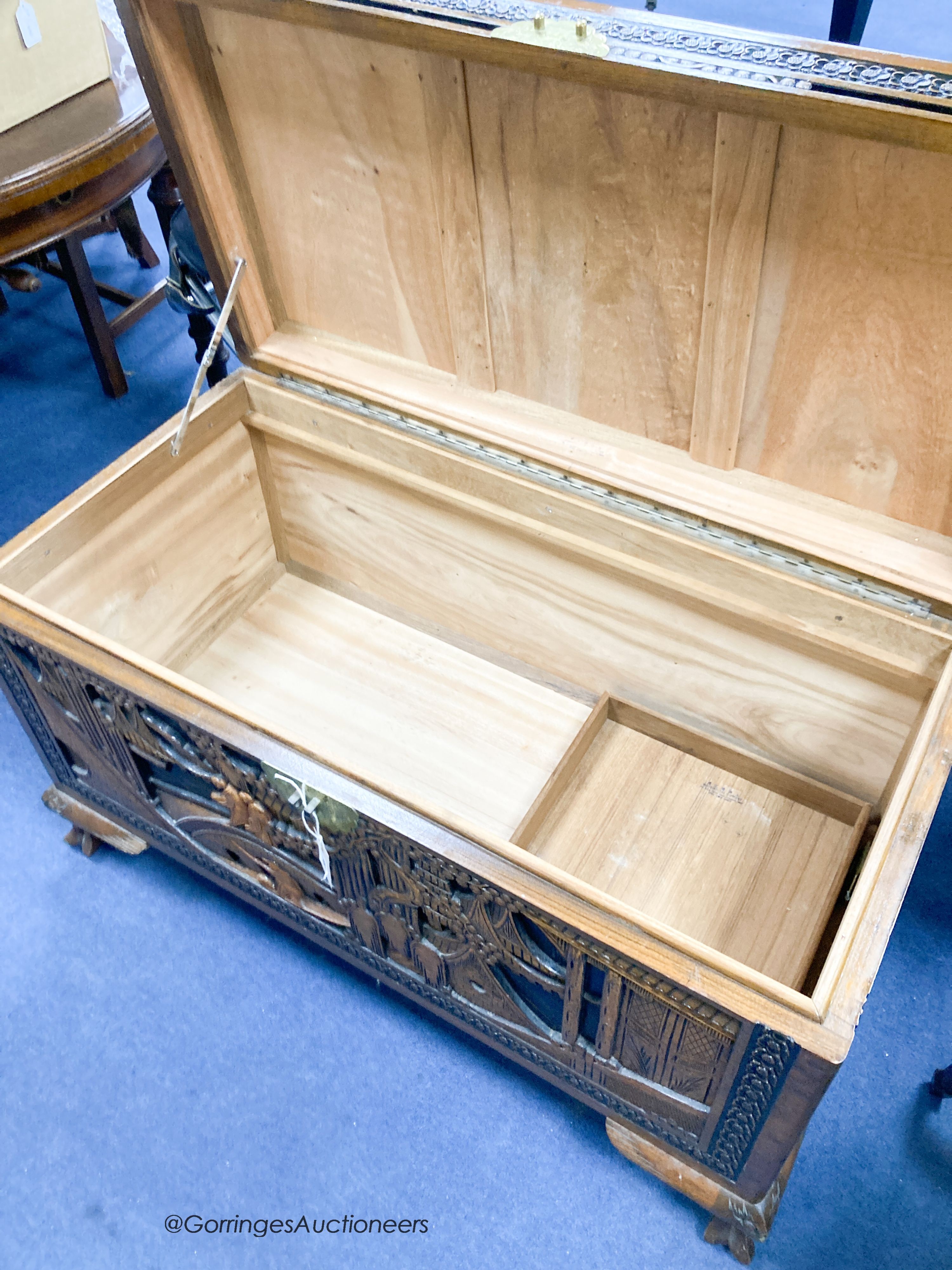 A Chinese carved camphorwood chest, width 102cm, depth 52cm, height 62cm